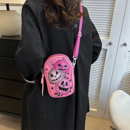 Halloween graffiti print crossbody bag in black with pumpkin, ghost, and bat designs, measuring 14x23x9.5cm