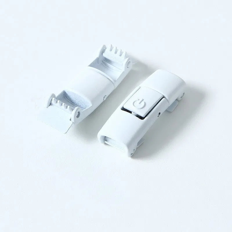 A pair of black widened flat elastic shoelaces with a silver press lock buckle on a white background.