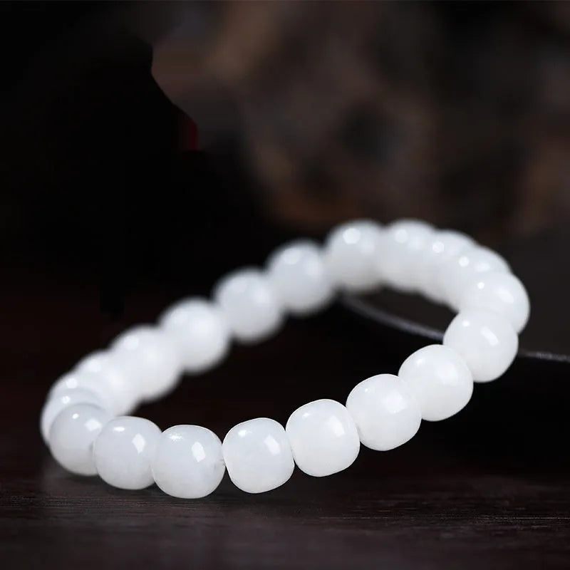 White jade barrel beads bracelet on wrist, showing Hetian jade stones in casual unisex design
