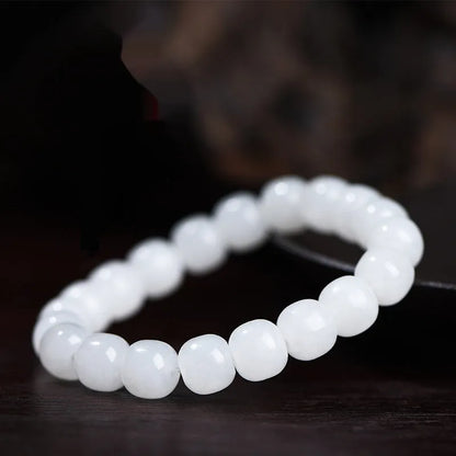 White jade barrel beads bracelet on wrist, showing Hetian jade stones in casual unisex design