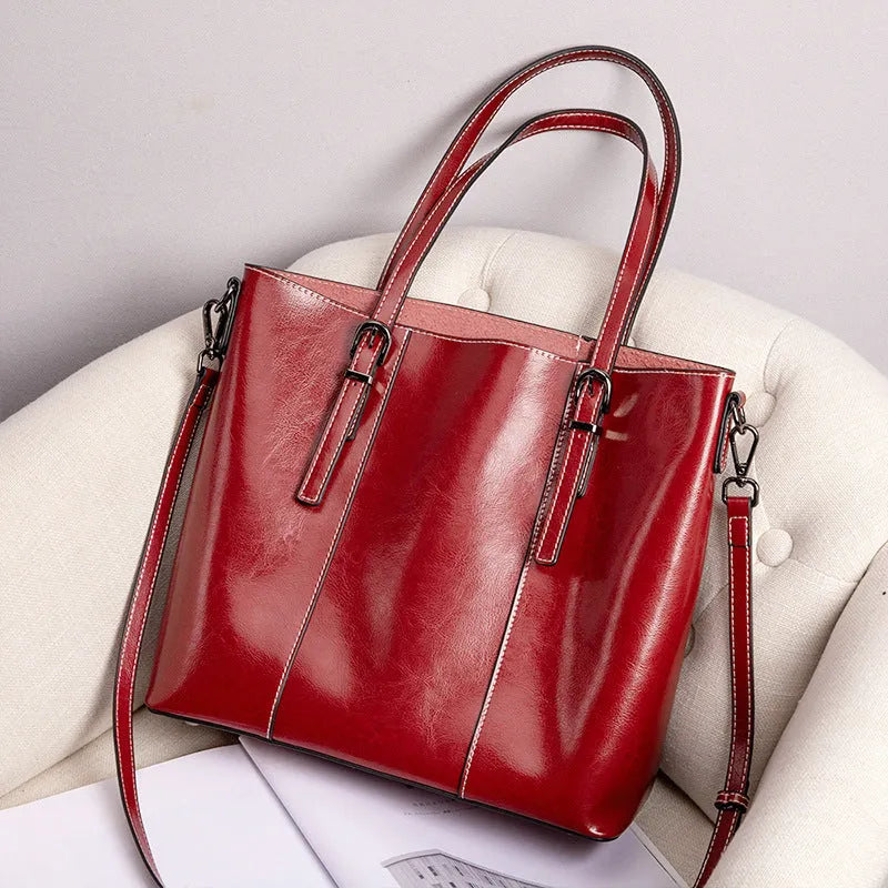 Brown genuine leather women's retro shoulder bag showing front view and organised interior pockets.
