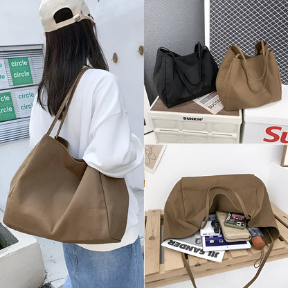 Solid colour women's canvas handbag with double shoulder straps showing internal mobile phone compartment