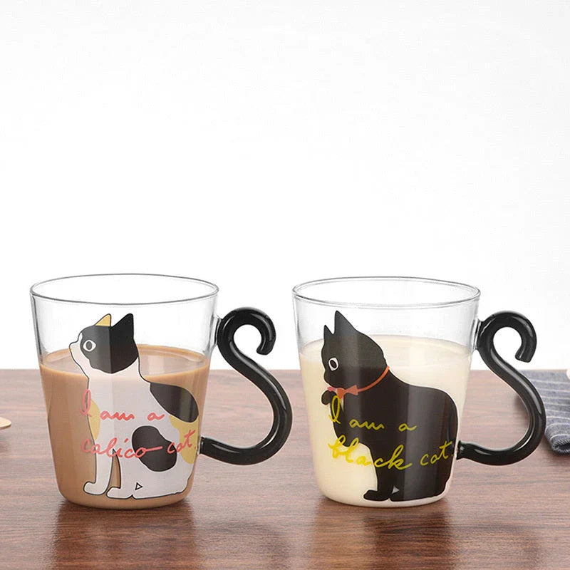 Adorable cat-shaped glass mug in black and white colors, perfect for coffee, tea, or juice
