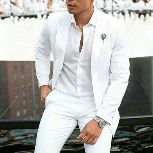 Men's white two-piece suit in slim fit for weddings, made from cotton blend fabric.