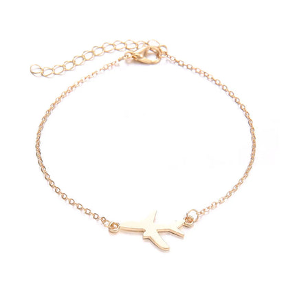 Set of three women's bohemian-style bracelets with heart charms showing an aircraft map design.