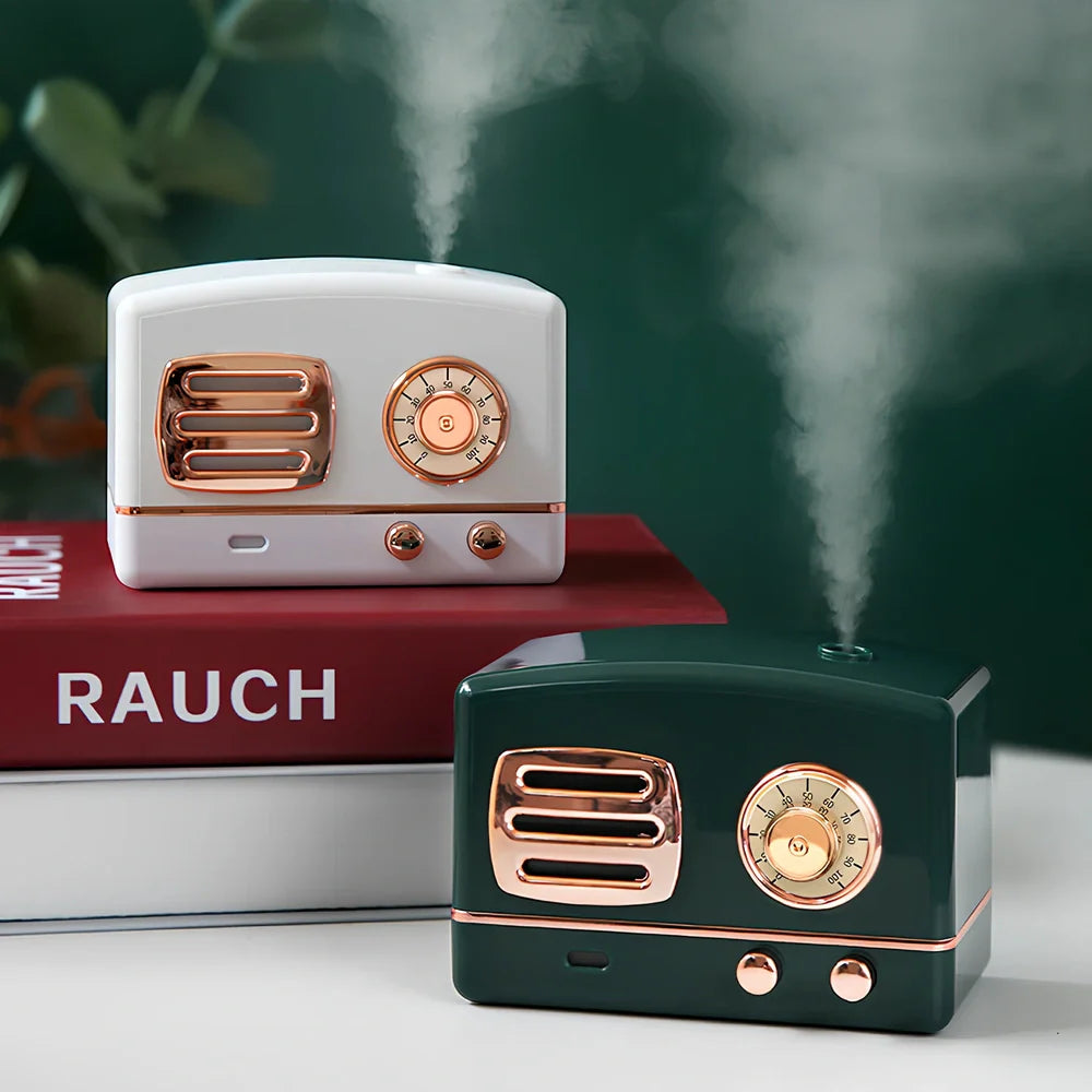 Green retro humidifier with bronzing finish measuring 9.5cm tall on wooden desk