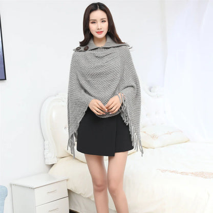 Sleeveless polka dot shawl in apricot colour draped over chair, showing 150cm length and acrylic fibre texture