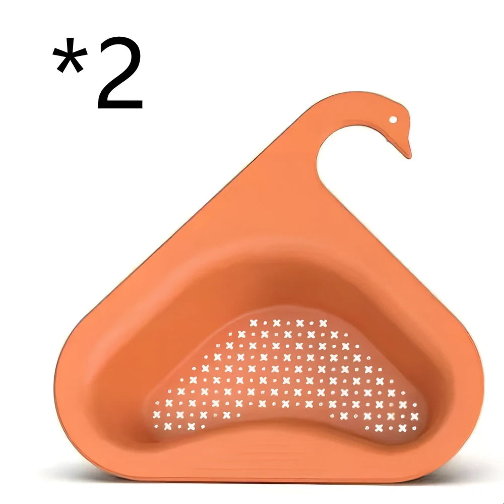 Yellow swan-shaped plastic kitchen drainer basket with drainage holes on kitchen counter