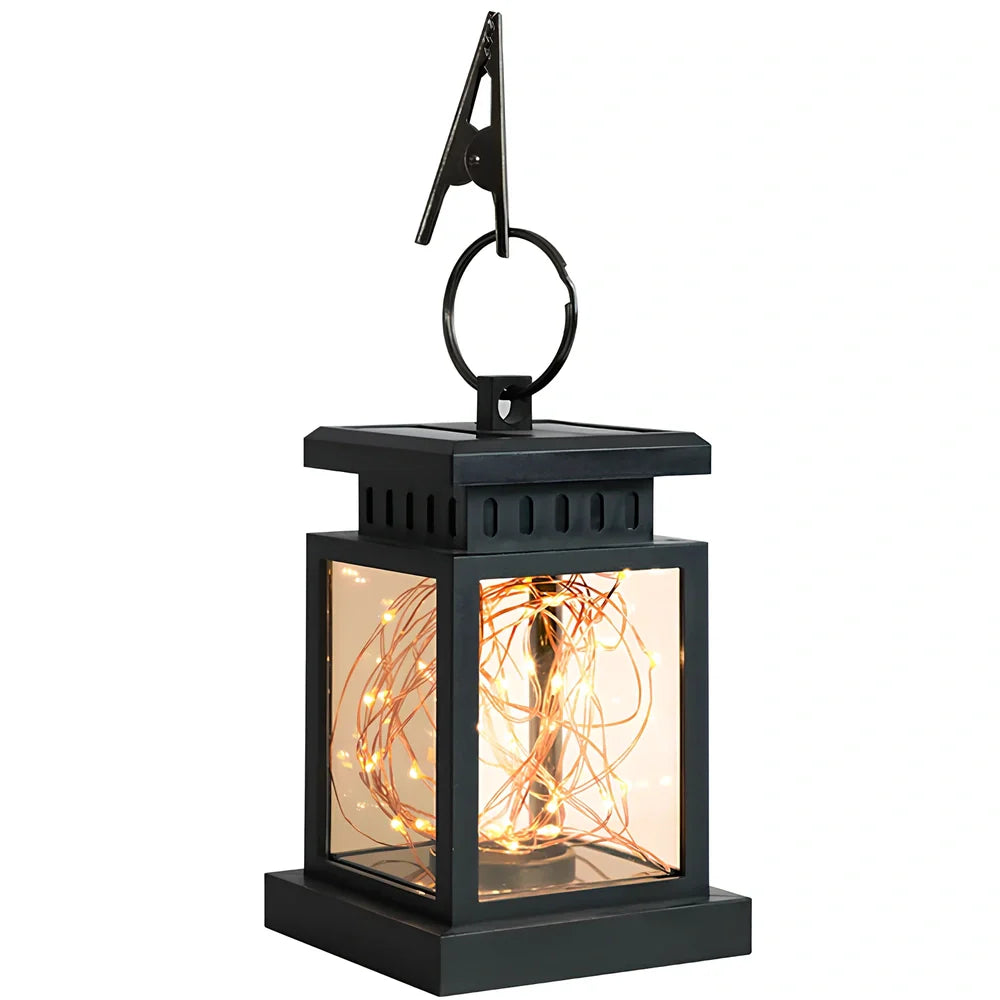 Black solar candle lamp with warm white LED illumination for outdoor gardens and patios