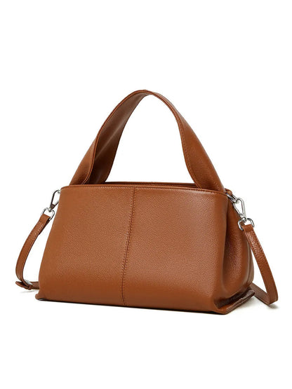 Women's genuine cowhide retro texture messenger bag in horizontal square shape, shown in apricot colour with double shoulder straps.