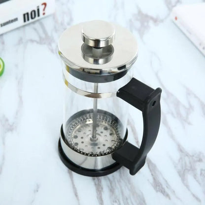 Compact manual pour over coffee maker with glass carafe and stainless steel filter, showing 350ml capacity.