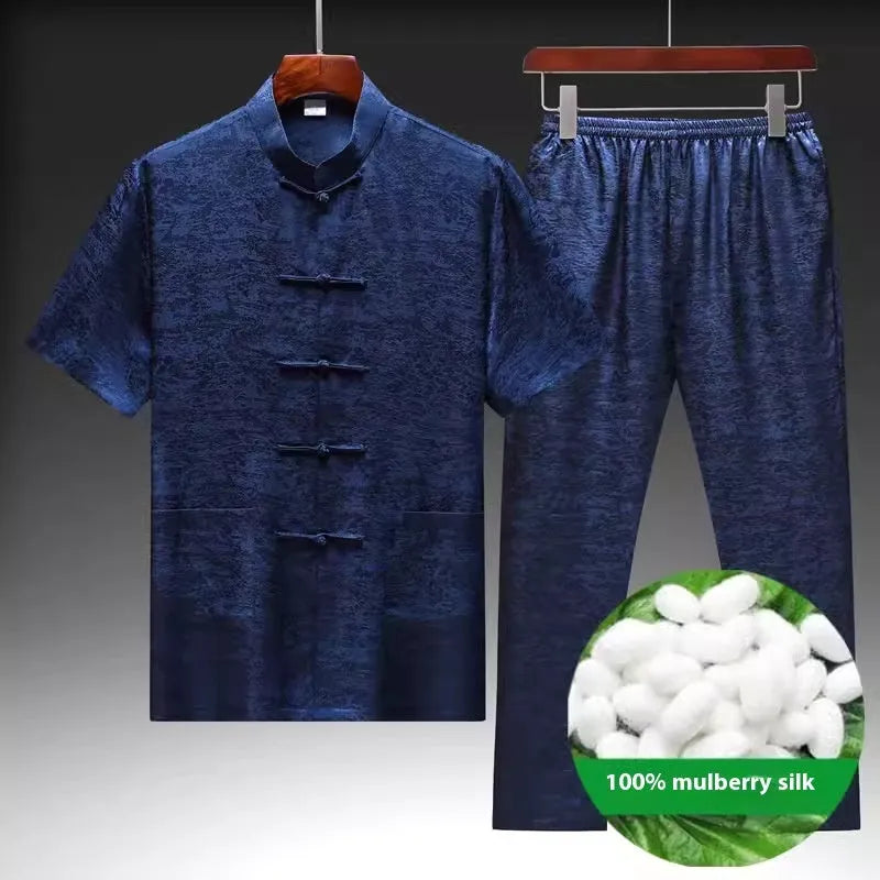 Traditional light green mulberry silk Tang suit for men on a hanger.