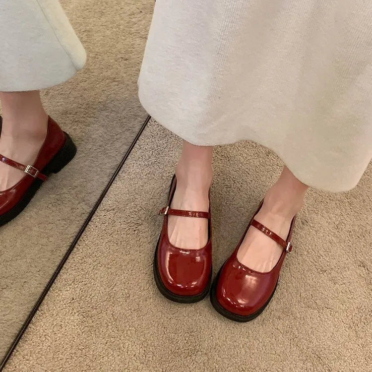 Women's solid colour French vintage leather shoes with round toe and flat heel design in red, black, and grey options
