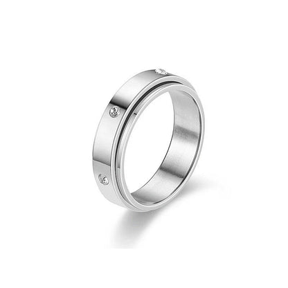 Stainless steel spinner ring with intricate moon and stars design