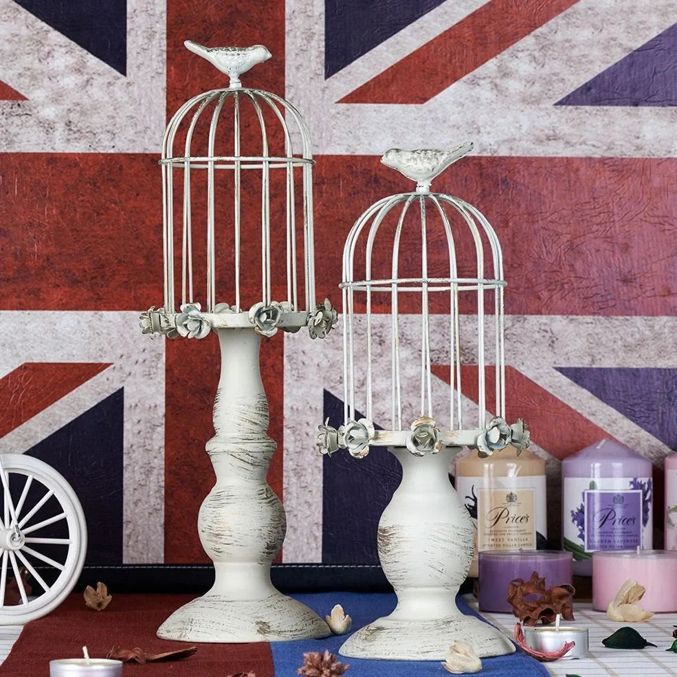 Iron candle holder with birdcage design measuring 37cm height and carved glass version at 33cm