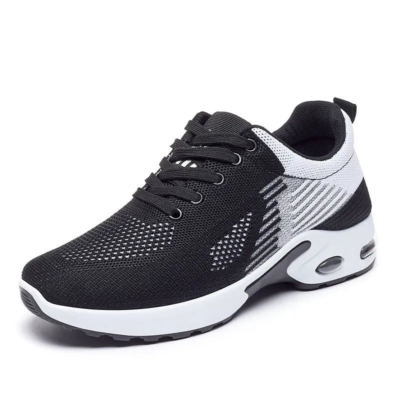 Women's striped Flyknit casual running shoes in pink, shown with a flat PVC sole and front lace-up closure.