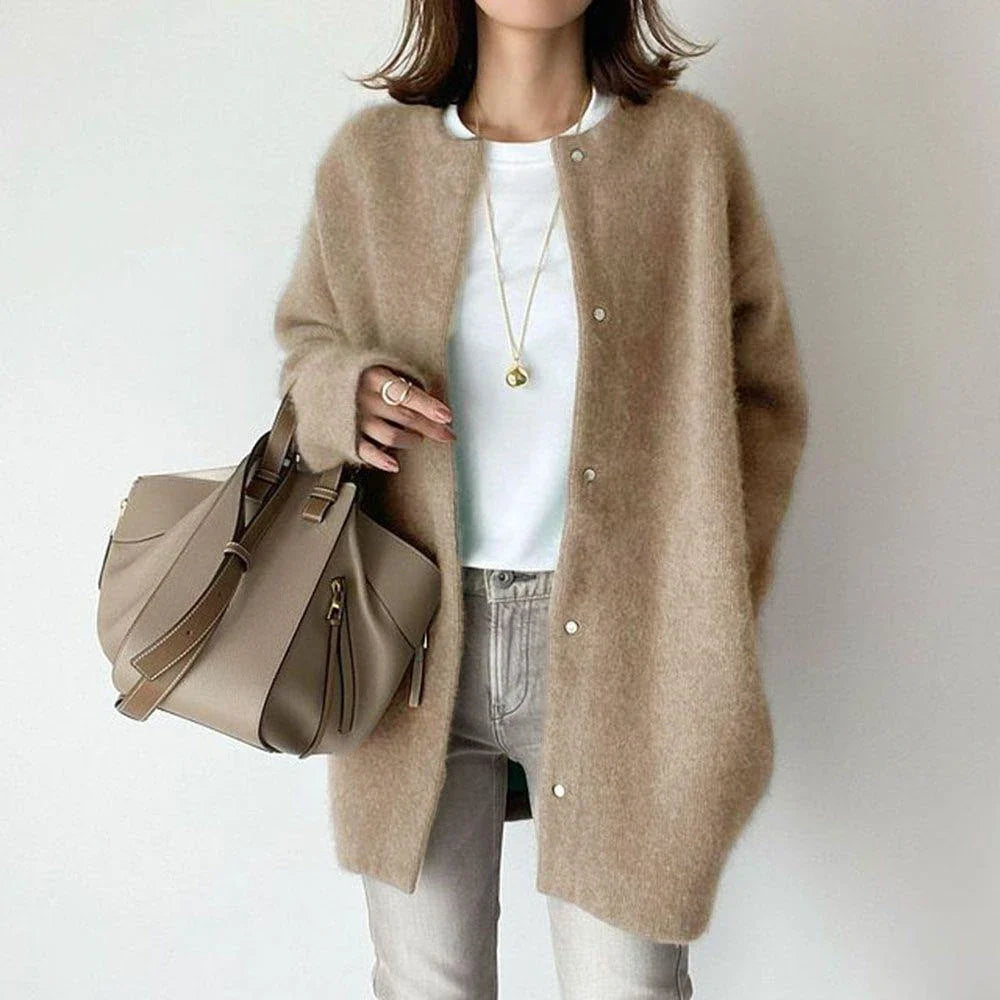 A cozy, knitted cardigan jacket in a variety of colors and sizes, featuring a relaxed open-front silhouette and premium construction for versatile layering.
