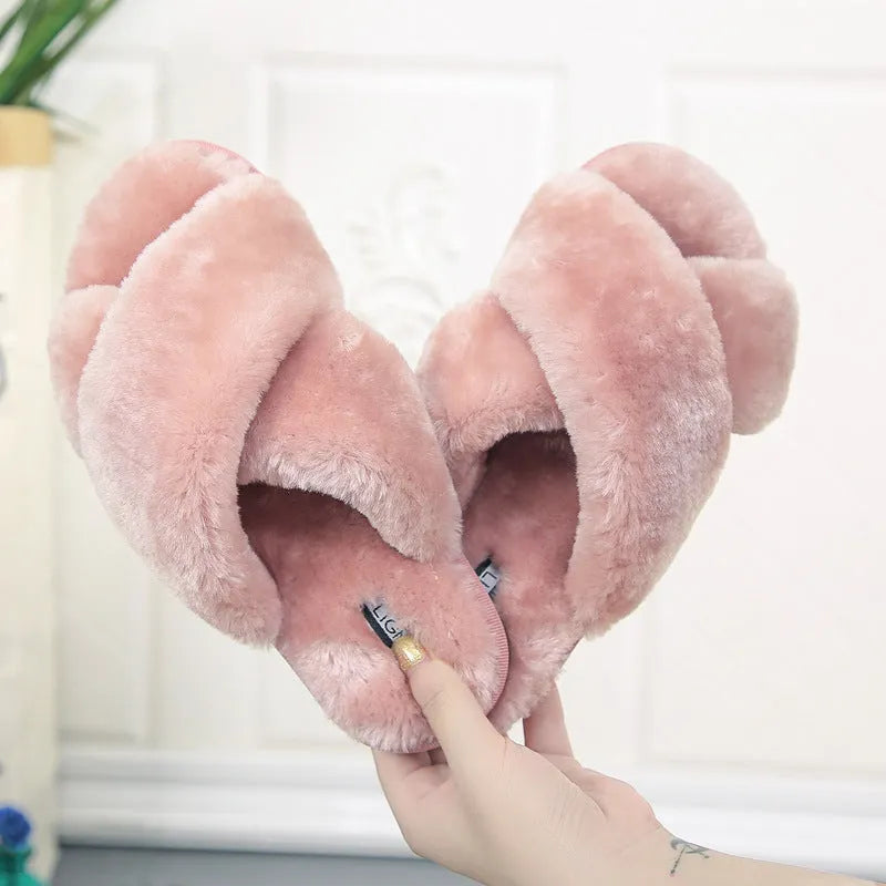 Cross open-toe fur slippers with non-slip patterned soles in black, showing ergonomic heel design