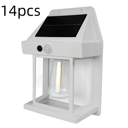 Black solar garden wall lamp with waterproof IP65 rating and automatic light sensor for outdoor installation