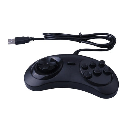 Black Sega-style USB game controller for PC with a long braided cable on a desk