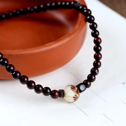 Natural rosewood double-ring bracelet with hand-knitted construction and retro floral design