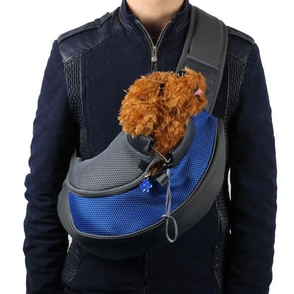 Blue pet backpack with mesh ventilation panels and adjustable padded shoulder straps for cat or small dog transport
