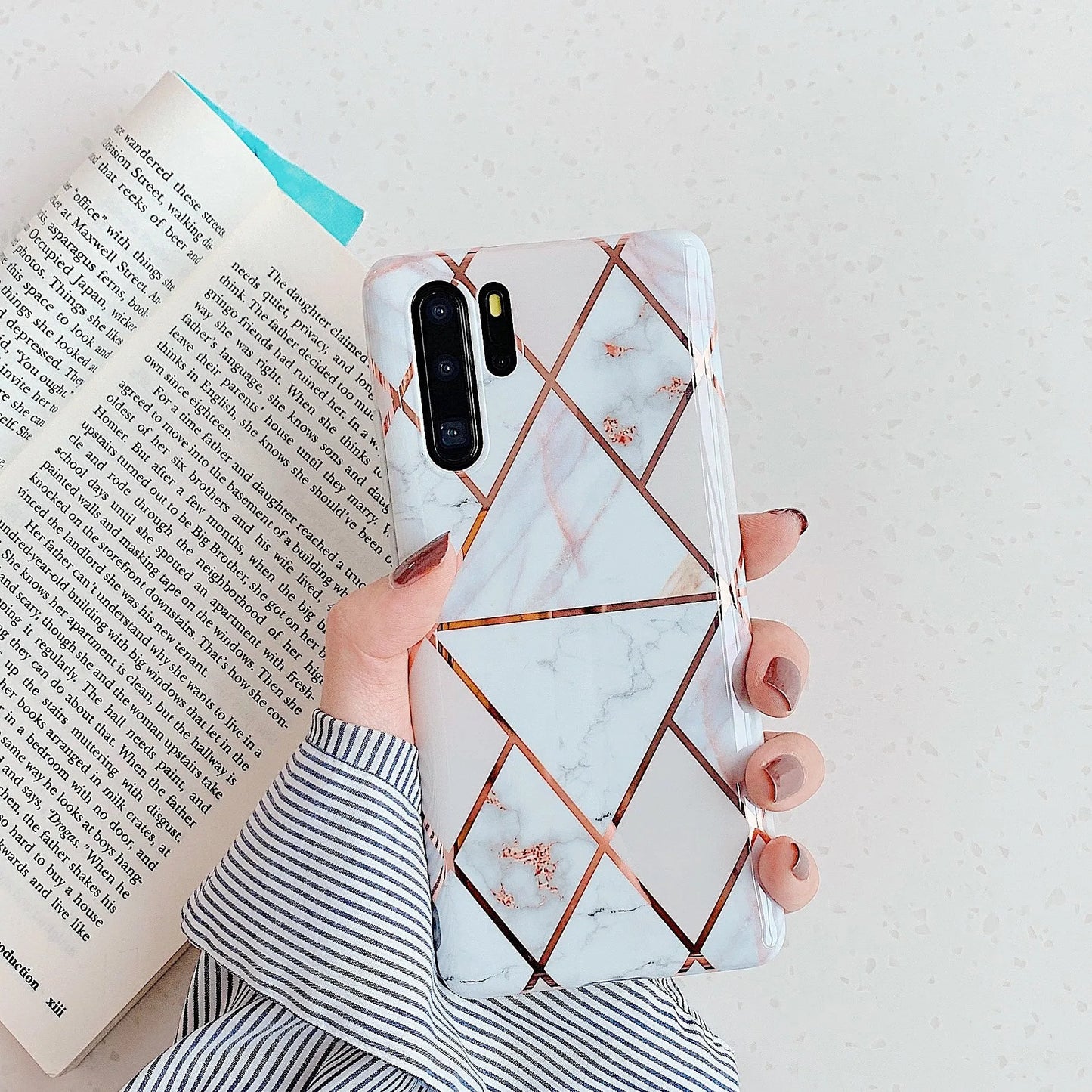 Electroplated marble mobile phone case in various colours for Huawei and Samsung models, showing slim TPU back cover design