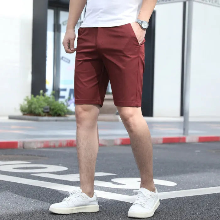 Men's loose elastic waistband fifth pants in solid colour casual styling