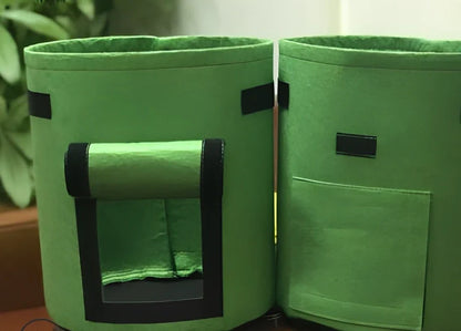 Black plant growth bag with side harvesting window and double handles for potato gardening