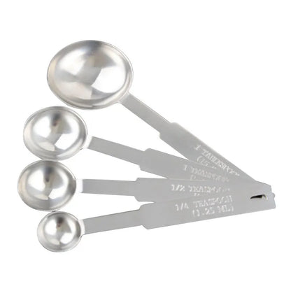 Six stainless steel measuring spoons with engraved markings and D-shape ring, sizes 1/8 tsp to 1 Tbsp
