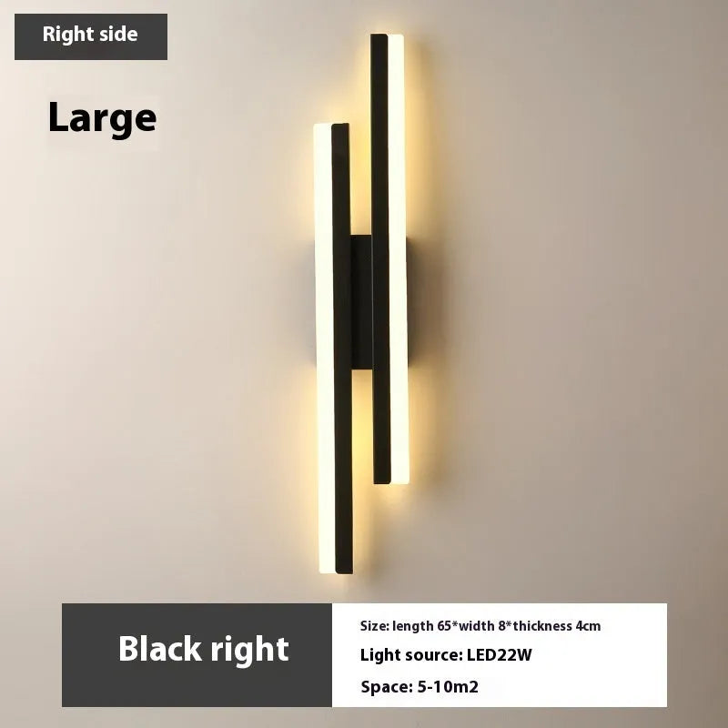 Scandinavian minimalist LED wall light with acrylic shade and adjustable arm in black or gold finish.