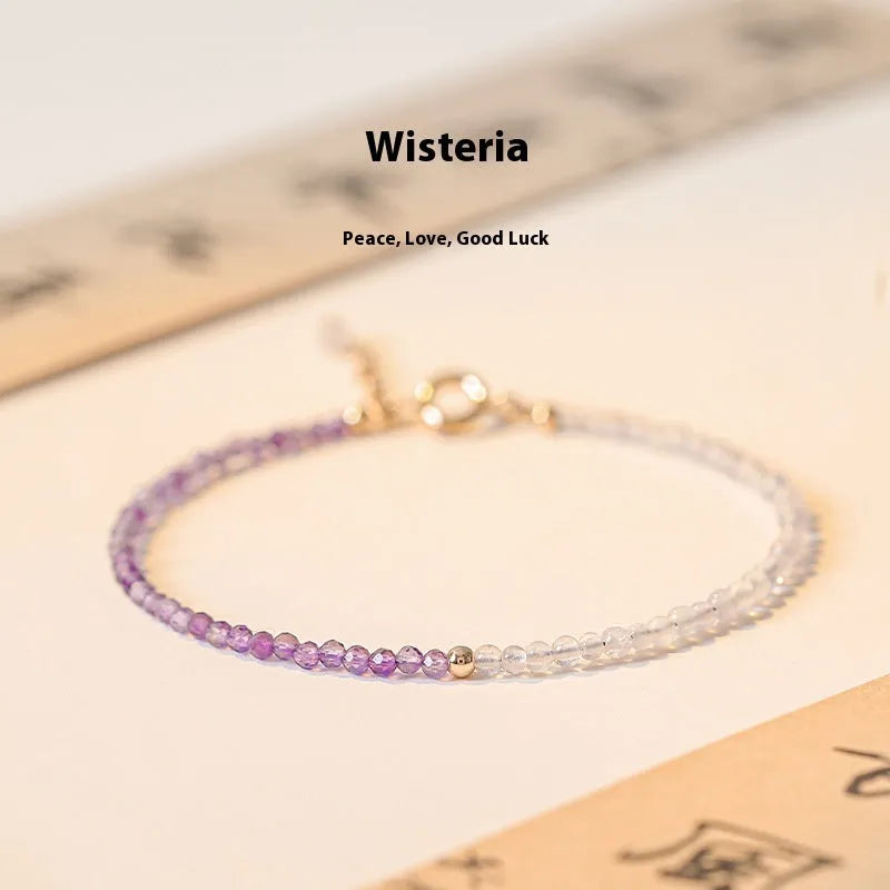 Purple geometric crystal bracelet threaded on 2mm purple rattan.