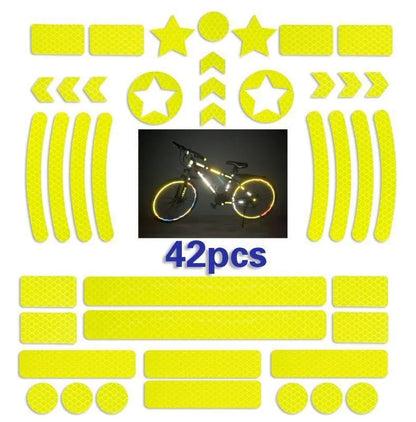Geometric grid pattern reflective safety tape for bicycles in blue, red, white, and fluorescent yellow.