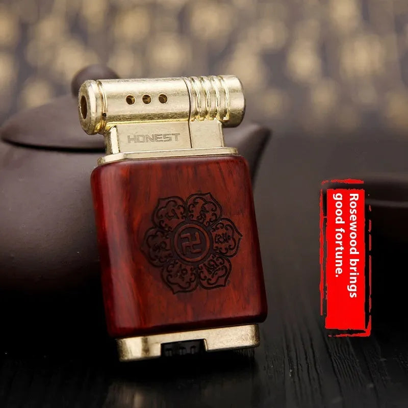 Ebony gas lighter with decorative rosewood and red wood carved panels