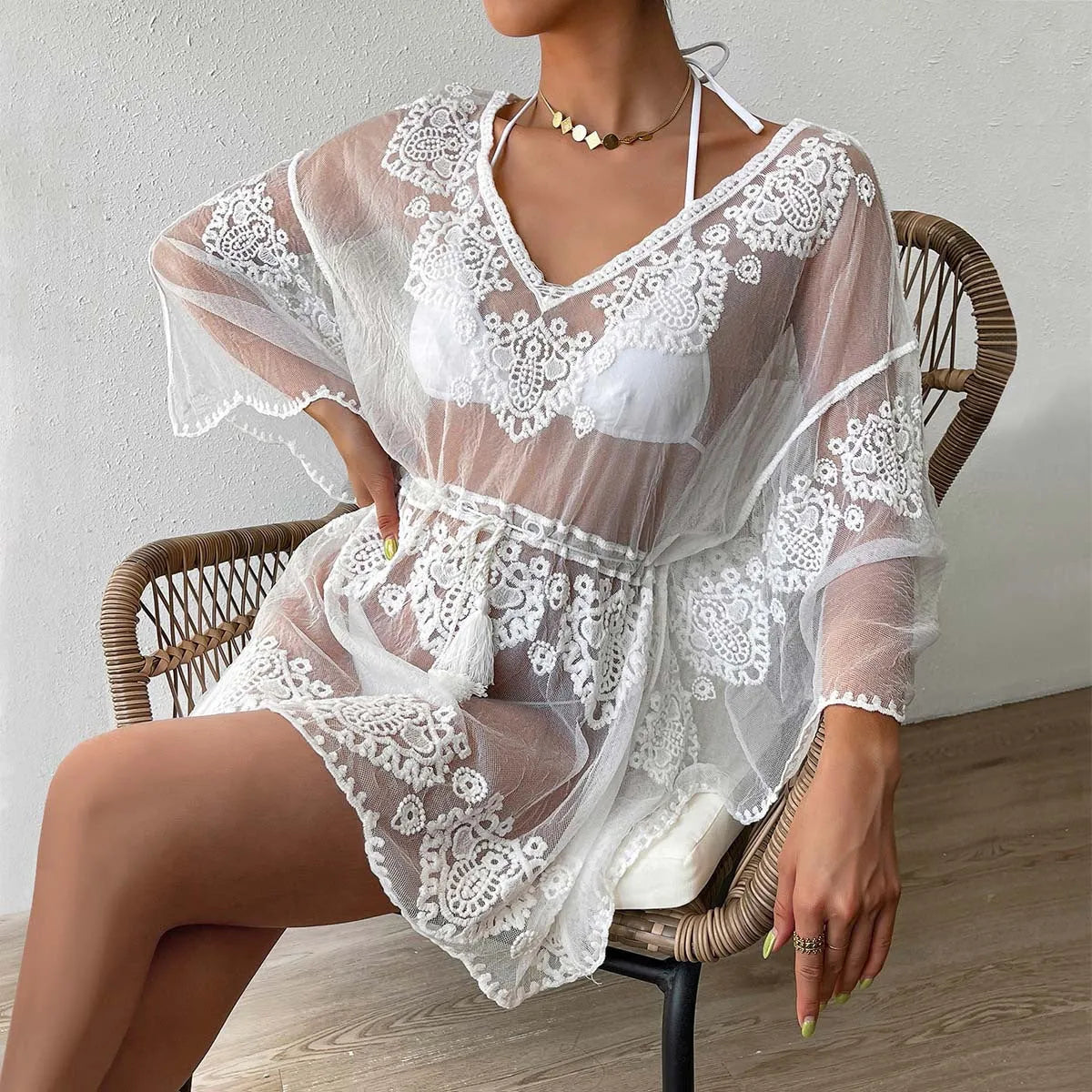 White free-size polyester beach blouse for women, a swimming cover-up with a cotton blend lining.