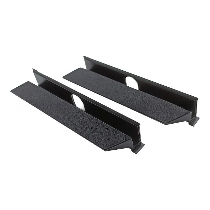Black PS4 Pro hard drive bottom cover replacement part, showing internal clip design.