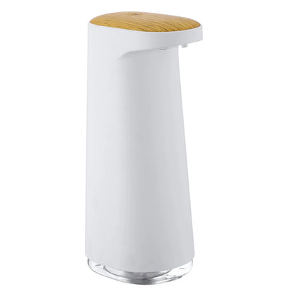 White automatic foam soap dispenser with infrared sensor on a bathroom countertop.