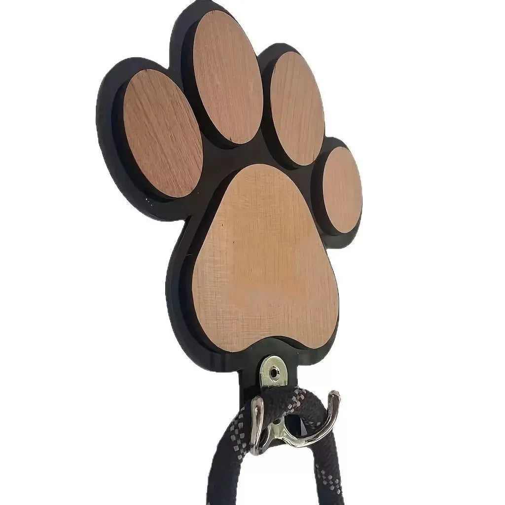 Black and white wooden paw print shaped wall hook for hanging keys or coats