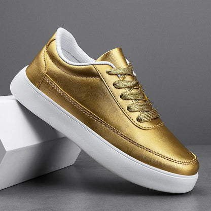 Women's lightweight leather flat casual shoes in gold colour with front lace-up design on a white background