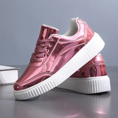 Rose gold and gold sequin platform sneakers with thick soles and round toe on a white background.