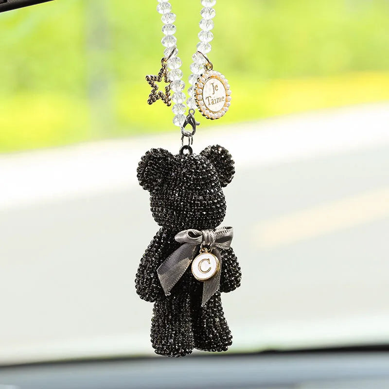 White artificial crystal rhinestone violent bear car rearview mirror pendant measuring 5x9cm.