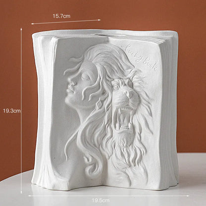 White ceramic book stand holding an open book at an angle, with a wire page holder in use.