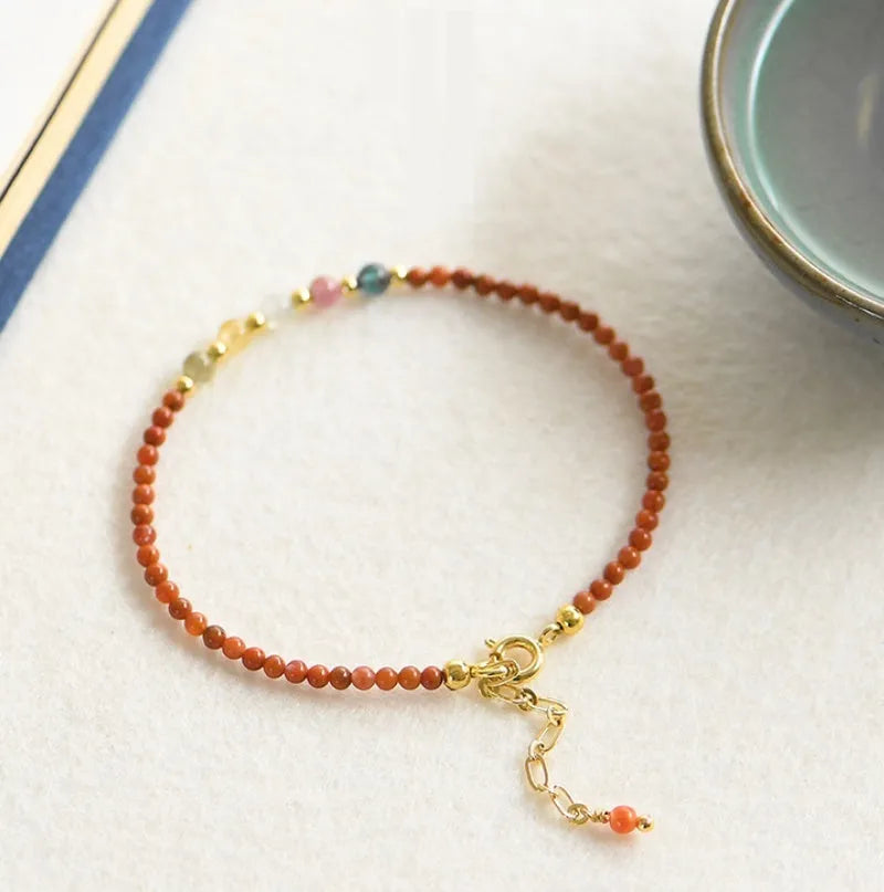 Natural freshwater pearl bracelet for women, featuring genuine freshwater pearls threaded on a clear elasticated cord with a stainless steel magnetic clasp closure, presenting a simple geometric style suitable for everyday wear and occasion jewellery.