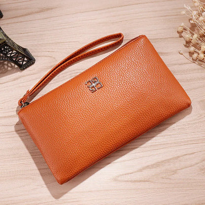 Long 55 cm PU leather wallet handbag in wine red colour with zipper closure open showing interior phone pocket and card slots