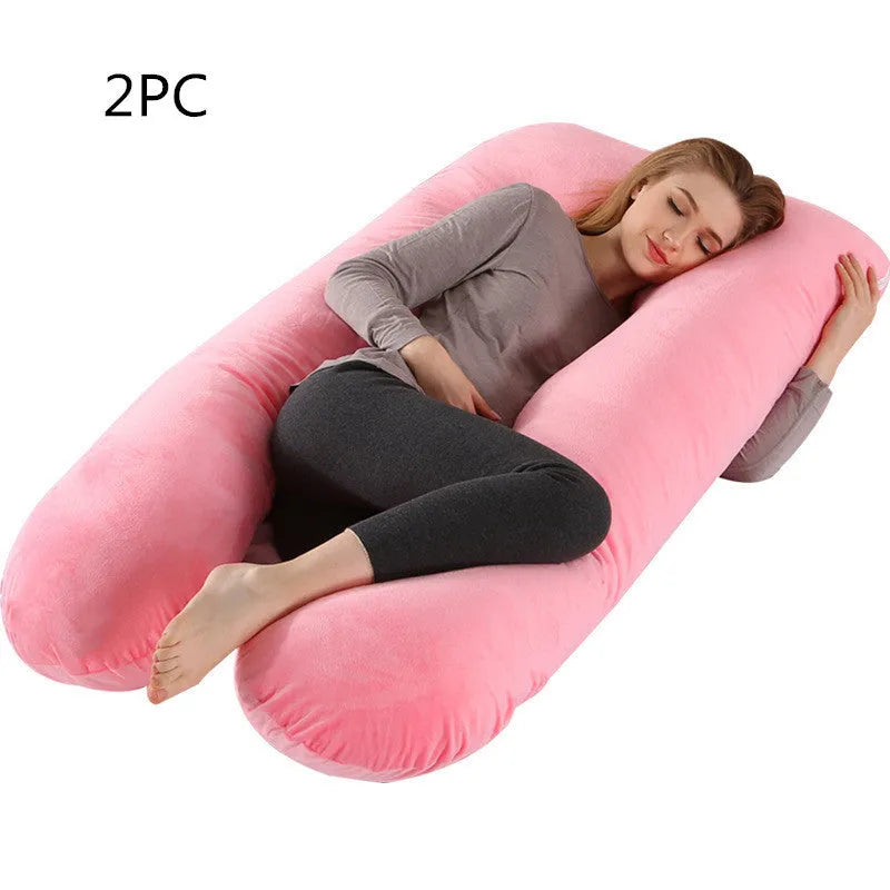 Large U-shaped pregnancy support pillow with removable cover and abdominal support belt.