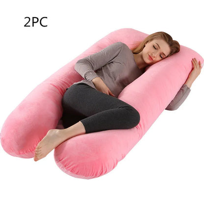 Large U-shaped pregnancy support pillow with removable cover and abdominal support belt.