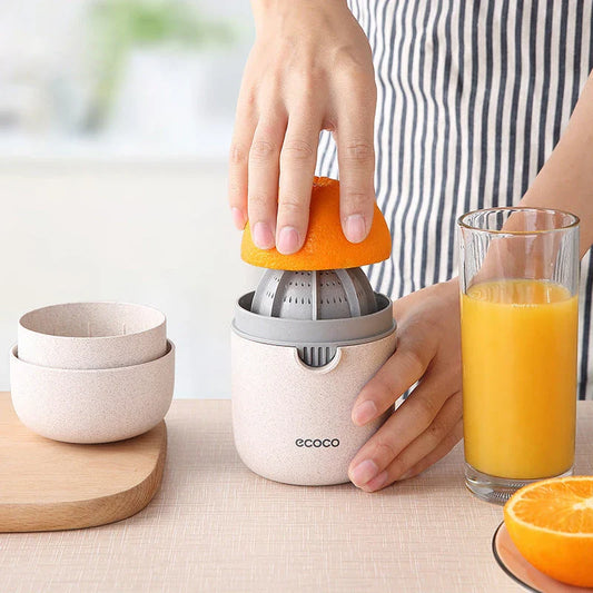 Versatile manual citrus juicer for extracting nutritious juices from oranges, lemons, grapefruits, and more using a compact and durable design