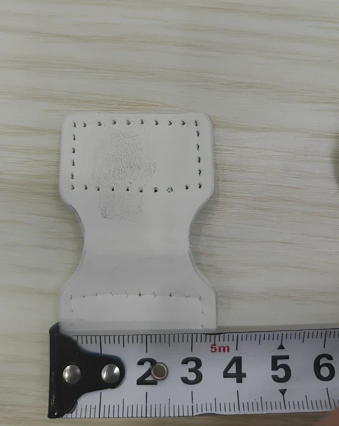 White adjustable silicone wristband with magnetic clasp closure showing 2.5cm width