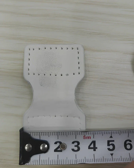 White adjustable silicone wristband with magnetic clasp closure showing 2.5cm width