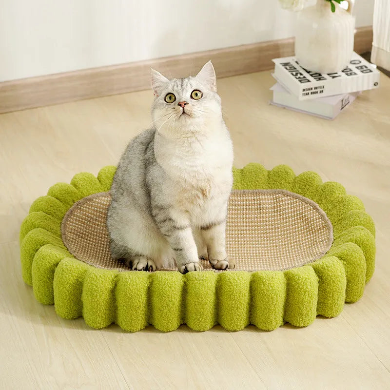 Green oval-shaped sisal cat scratching pad with a central bowl, serving as a cat bed and furniture protector.